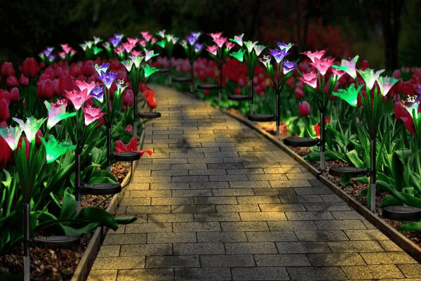 decorative solar garden lights line a cobblestone walkway